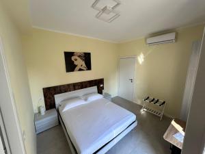 Postel nebo postele na pokoji v ubytování Urban Suite Milano