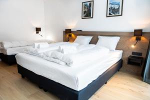 Łóżko lub łóżka w pokoju w obiekcie Gerlos Alpine Estate - Gerlos