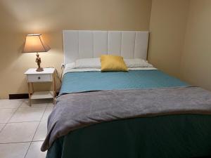 Postel nebo postele na pokoji v ubytování Aparta-hotel Carmela #4 Aire acondicionado