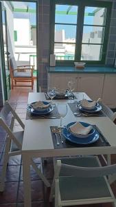 a table with plates of food on top of it at famarabeach2 in Famara +18 photos