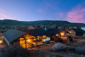 an aerial view of a house with a mountain in the background at The Raven By The Cohost Company in Pioneertown