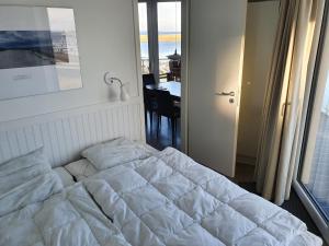 Postel nebo postele na pokoji v ubytování Ferienwohnung Austernfischer Marina Wendtorf