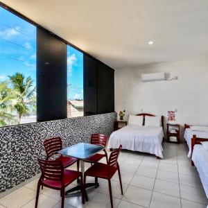 Postel nebo postele na pokoji v ubytování Maraga Beach Hostel