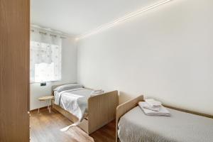 Postel nebo postele na pokoji v ubytování Appartamento Bucaneve - Padola