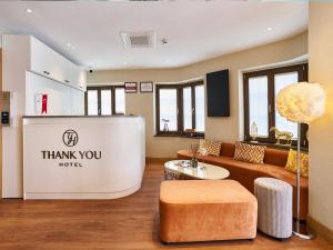 a living room with a couch and a table at Thank You Hotel Sultanahmet in Istanbul
