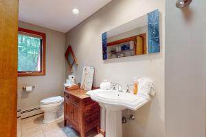 a bathroom with a sink and a toilet at Writer's Retreat in Wells +49 photos
