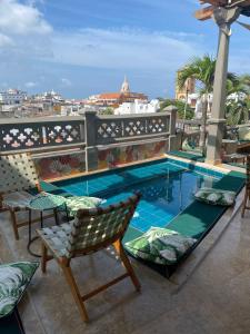 a swimming pool on the roof of a building at Townhouse Boutique Hotel in Cartagena de Indias +160 photos