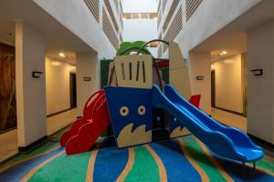 a playground with a bag on a slide at CB Suite Homes in Mandurriao