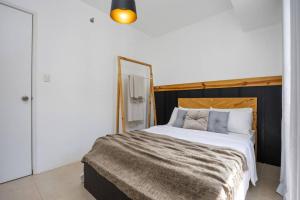Легло или легла в стая в Furnished 2-Bedroom in Avida Towers Riala, Cebu IT Park with Fast WiFi, Netflix, Pool and More