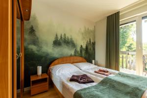 Posteľ alebo postele v izbe v ubytovaní Apartament Barbara