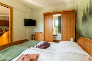 Posteľ alebo postele v izbe v ubytovaní Apartament Barbara