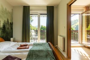Posteľ alebo postele v izbe v ubytovaní Apartament Barbara
