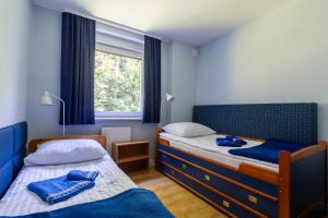 Posteľ alebo postele v izbe v ubytovaní Apartament Barbara