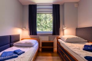 Posteľ alebo postele v izbe v ubytovaní Apartament Barbara
