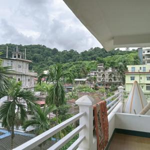 a balcony with a view of a city at Panchalaya Homestay in Guwahati