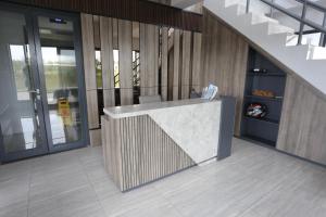 a lobby with a reception desk in a building at Apartemen Riverdale Cikarang by Alfa Rooms in Rawasuren