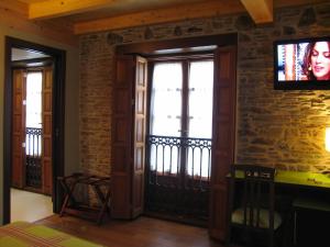 TV a/nebo společenská místnost v ubytování Hotel Rolle