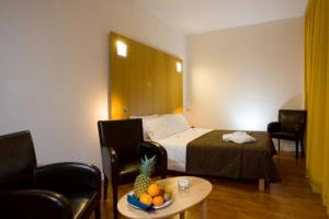 Postel nebo postele na pokoji v ubytování Executive Hotel + 31 fotografií