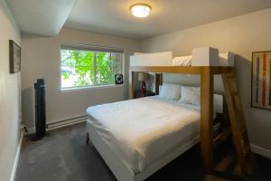 a bedroom with a bunk bed and a window at First Tracks 4105 in Steamboat Springs +30 photos