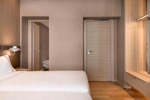 Postel nebo postele na pokoji v ubytování AC Hotel by Marriott Clodio Roma + 37 fotografií
