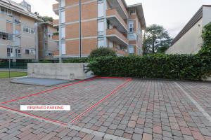 a brick parking lot in front of a building at Interno 711 in Udine