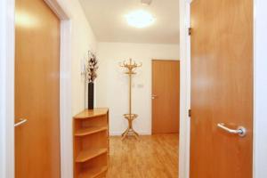 a hallway with a room with a door and a shelf at 2-Bed Condo Best of Beach & City, FREE Parking in Aberdeen