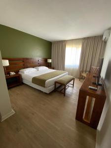 Postel nebo postele na pokoji v ubytování Hotel Limari
