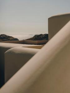 a view of the sand dunes with the ocean in the background at The Wild by Interni in Kalafatis