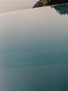 a view of the ocean from a boat in the water at The Wild by Interni in Kalafatis