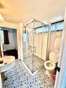 a bathroom with a shower and a toilet and a sink at 77 Old Town in Bangkok +51 photos