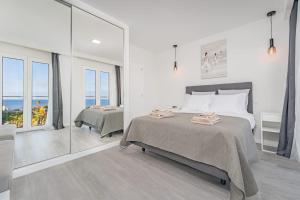 Giường trong phòng chung tại JPL Blue Horizon Residential - Casa Horizon A +27 ảnh