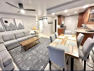 a living room with a couch and a table at Remodeled Ski in and ski out Condo! in Breckenridge