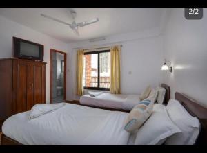 Letto o letti in una camera di Pacific Guest House