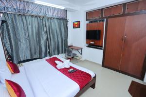 Postel nebo postele na pokoji v ubytování AS HOMES Chennai