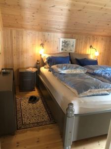 Postel nebo postele na pokoji v ubytování Amazing cabin in spectacular Lyngen