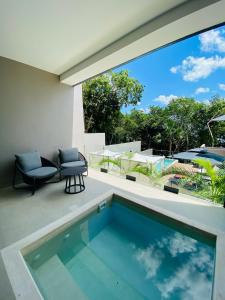 Bazén v ubytování Amaranto Bacalar Hotel Boutique nebo v jeho okolí
