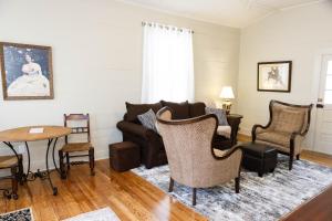 a living room with a couch and chairs and a table at Sweet Auntie in Natchez