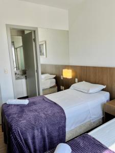 Cama ou camas em um quarto em LK Barro Preto 6