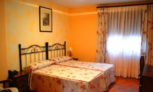 Postel nebo postele na pokoji v ubytování Hospedería de Antonia