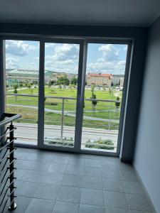a room with a window with a view of a field at Studio Green in Świebodzice