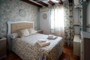 Łóżko lub łóżka w pokoju w obiekcie CASA DAGO