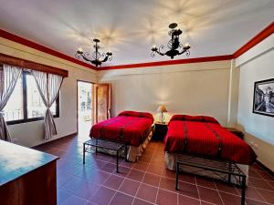 A bed or beds in a room at Hotel Jotam