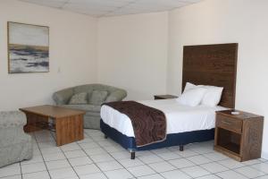 Postel nebo postele na pokoji v ubytování Hotel Sntenario