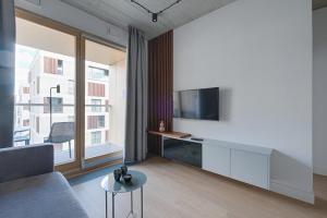 TV a/nebo společenská místnost v ubytování GO Apartments - ApartHotel