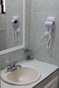 Koupelna v ubytování Hotel Sntenario