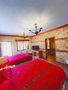 A bed or beds in a room at Hotel Jotam
