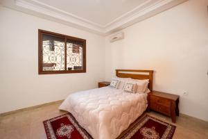 Ένα ή περισσότερα κρεβάτια σε δωμάτιο στο Beautiful Central Marrakech Villa +14 φωτογραφίες