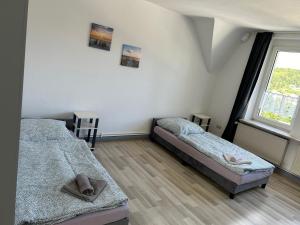 Ένα ή περισσότερα κρεβάτια σε δωμάτιο στο Monteurwohnung Haus Elbert 4