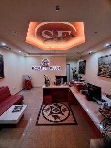 an office with a reception desk in a room at Apartments Keesi 1 in Durrës