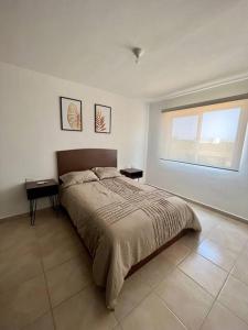 a bedroom with a large bed and a window at Villa Sol Terrasol Acapulco Diamante in Acapulco +36 photos